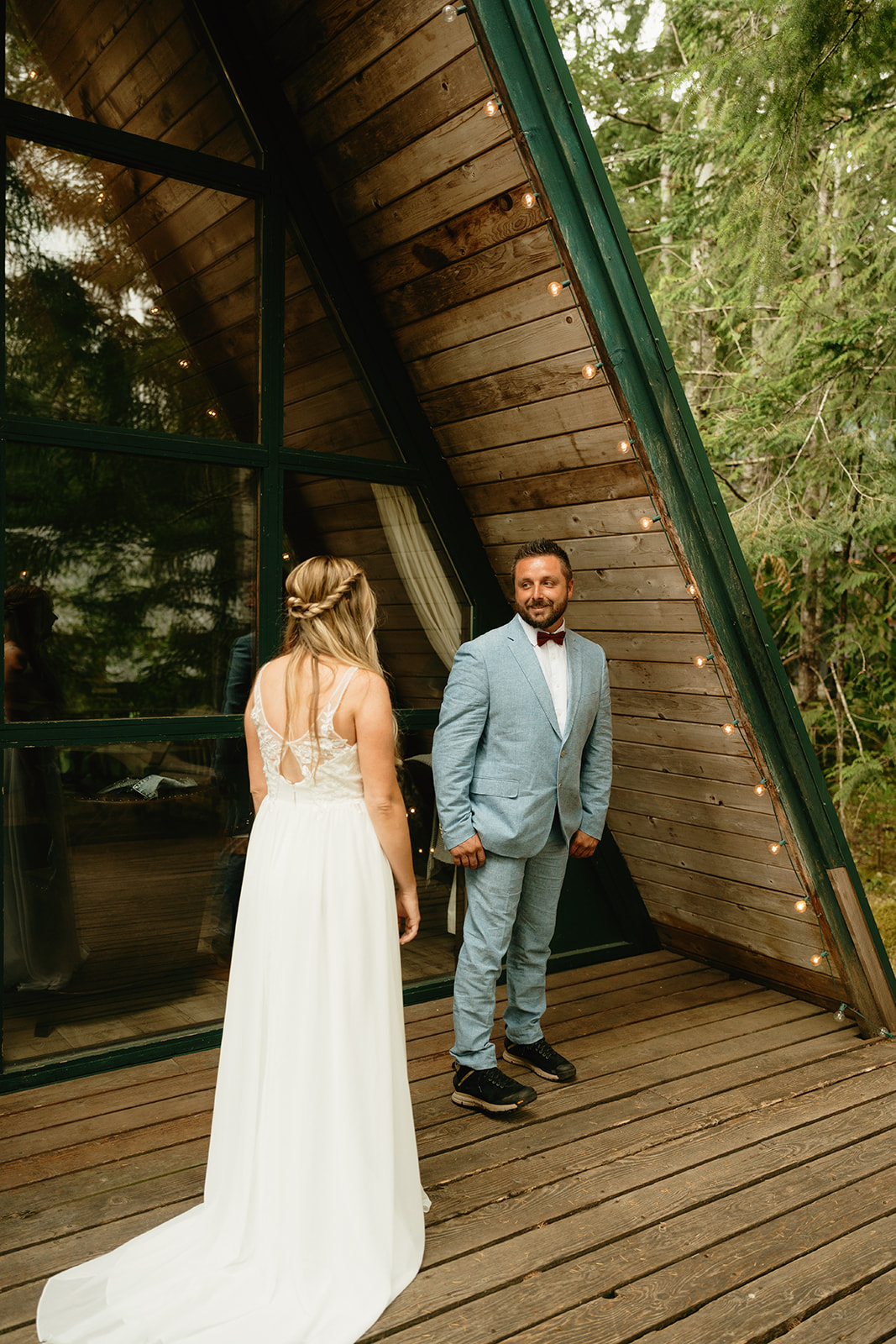 Groom turning around to see his bride during first look at mount rainier national park