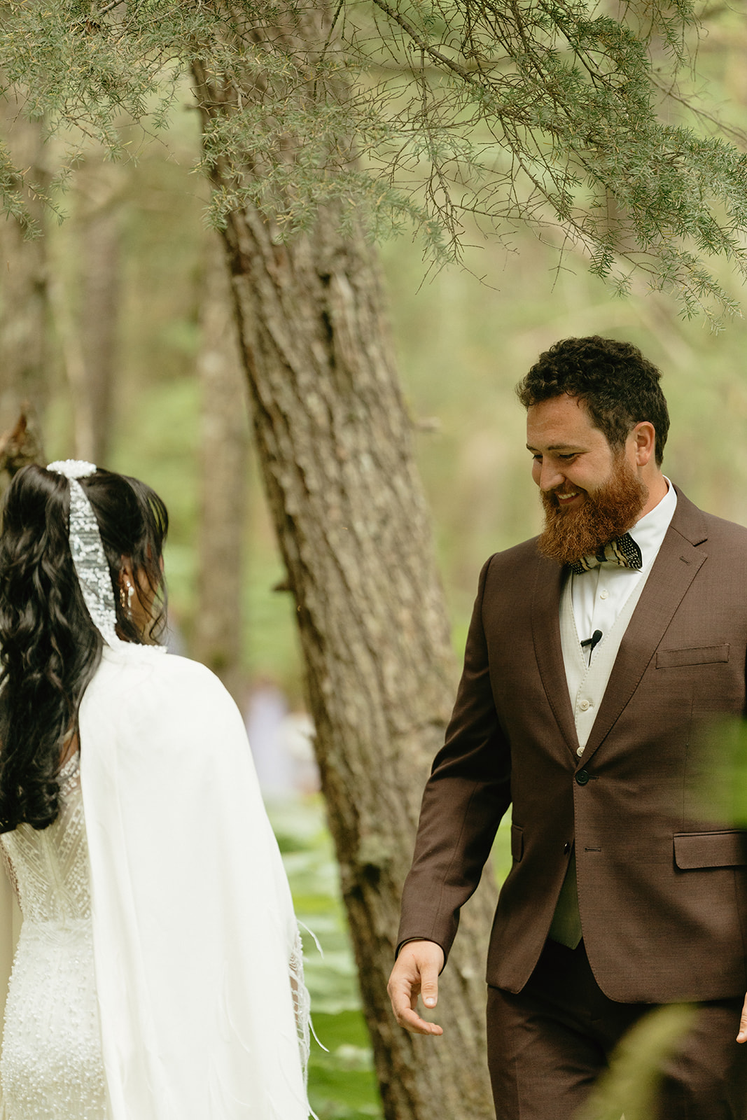 Groom turns around to see bride for the first time on their wedding day.