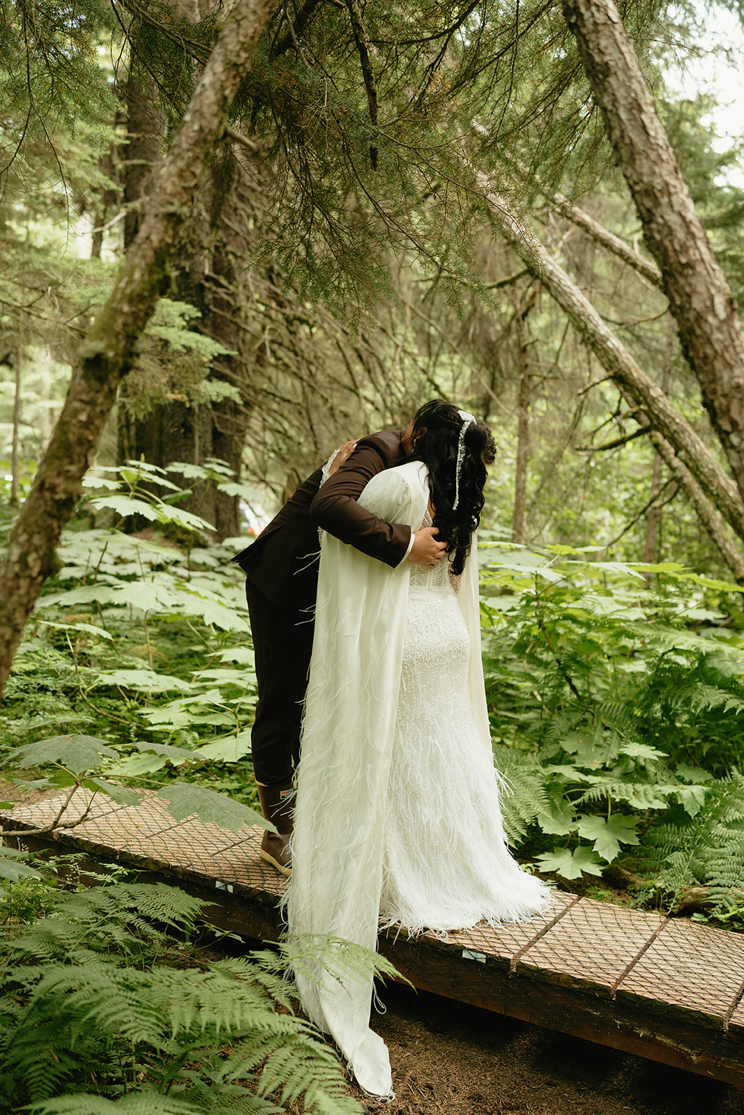 Groom hugs bride after seeing her for the first time before eloping to Alaska