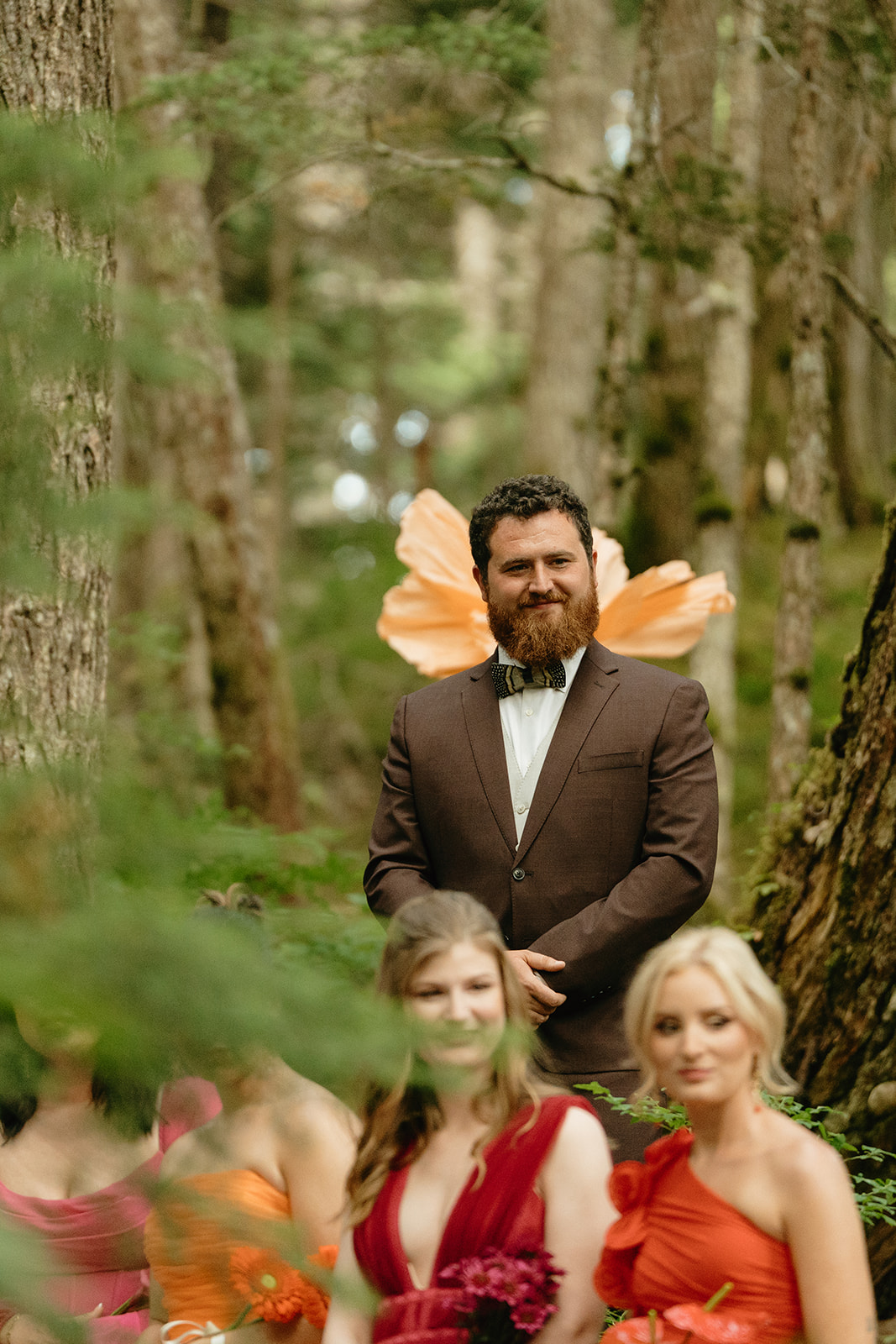 Groom beaming with excitement and joy as bride begins to walk towards him