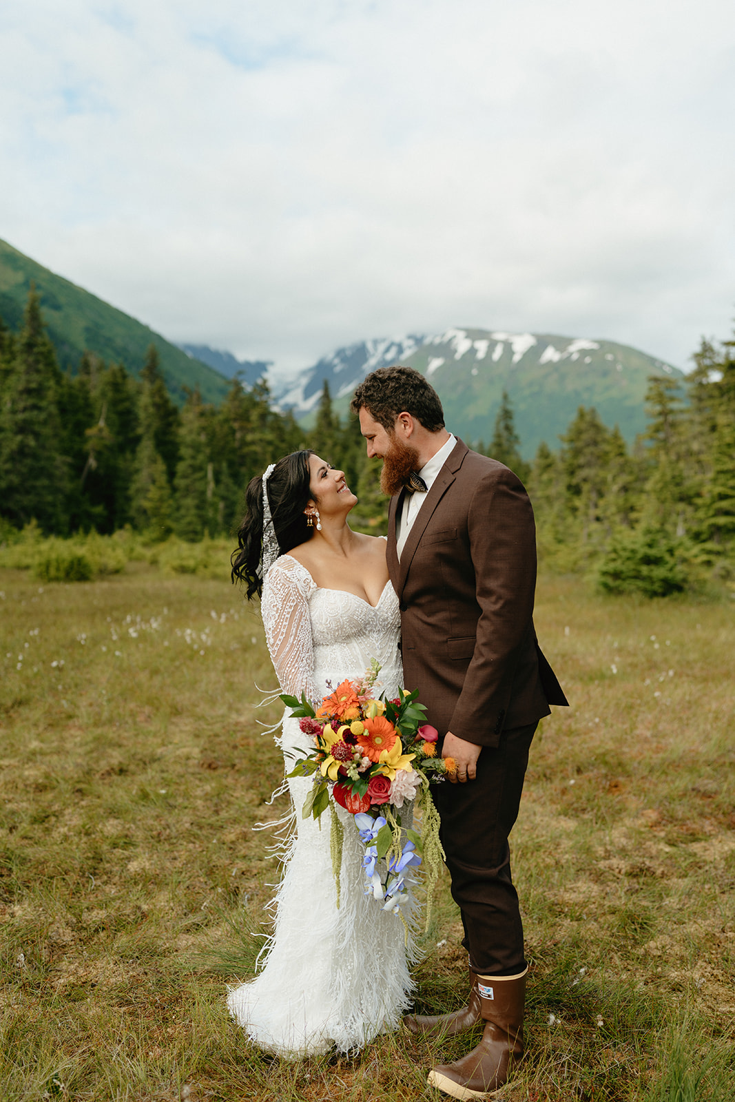 Newly married couple looking at one another with pure love and joy in their eyes.