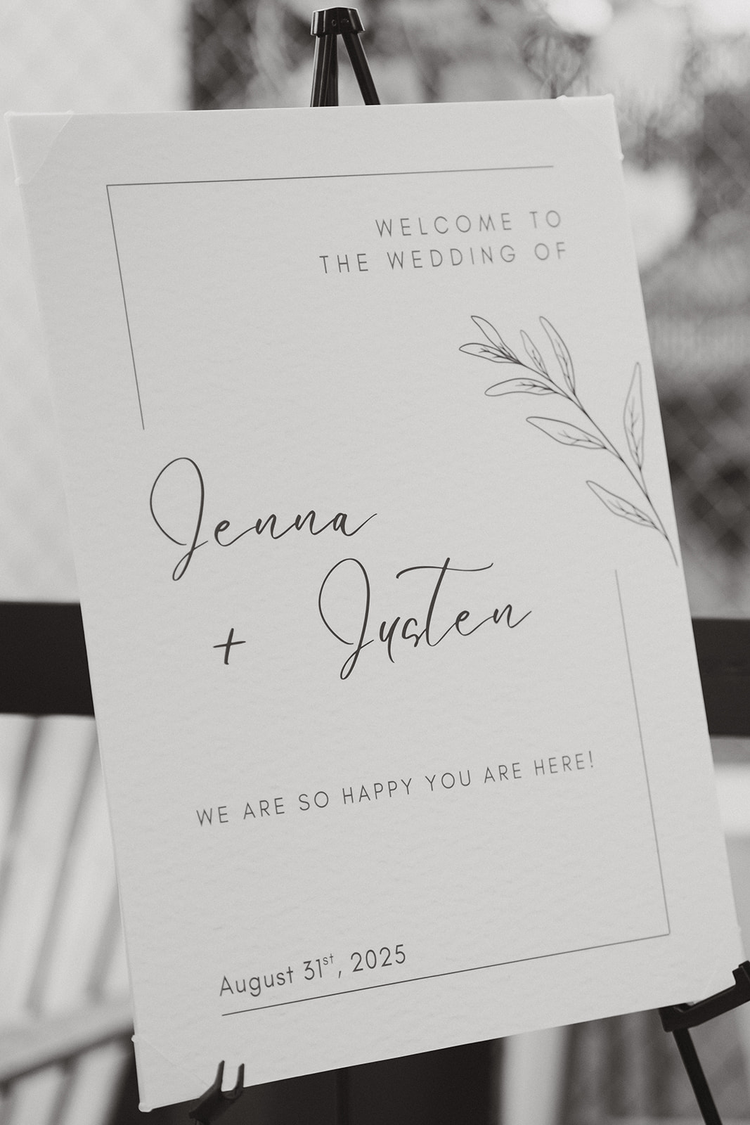 Minimalist black and white wedding welcome sign for Jenna and Justen's celebration, dated August 31st, 2025.