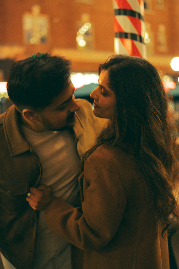 Cinematic couple leaning into one another and holding each other close in Seattle