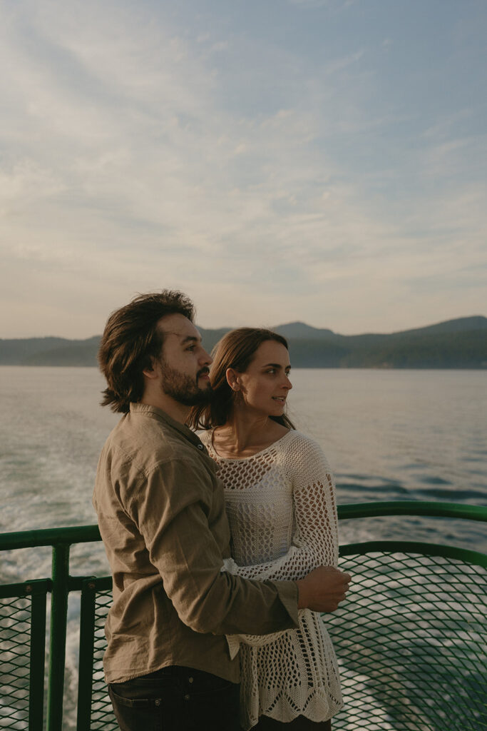 Couple overlooking the water on a Washington State Ferry