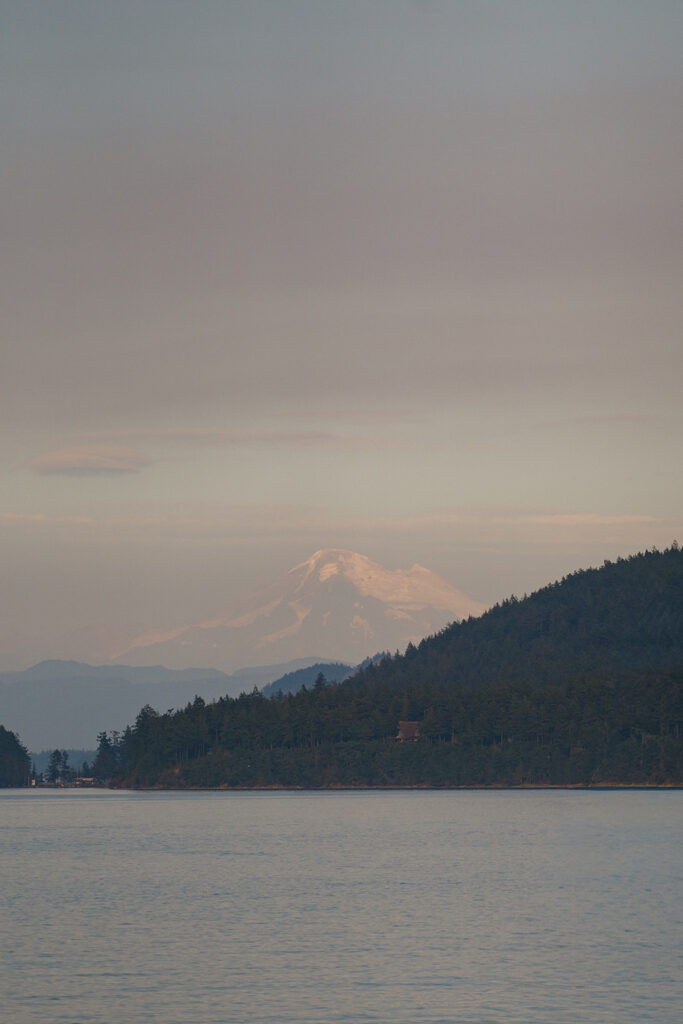 Mount Baker full of pastel blue and pink colors during blue hour in the San Juan Islands