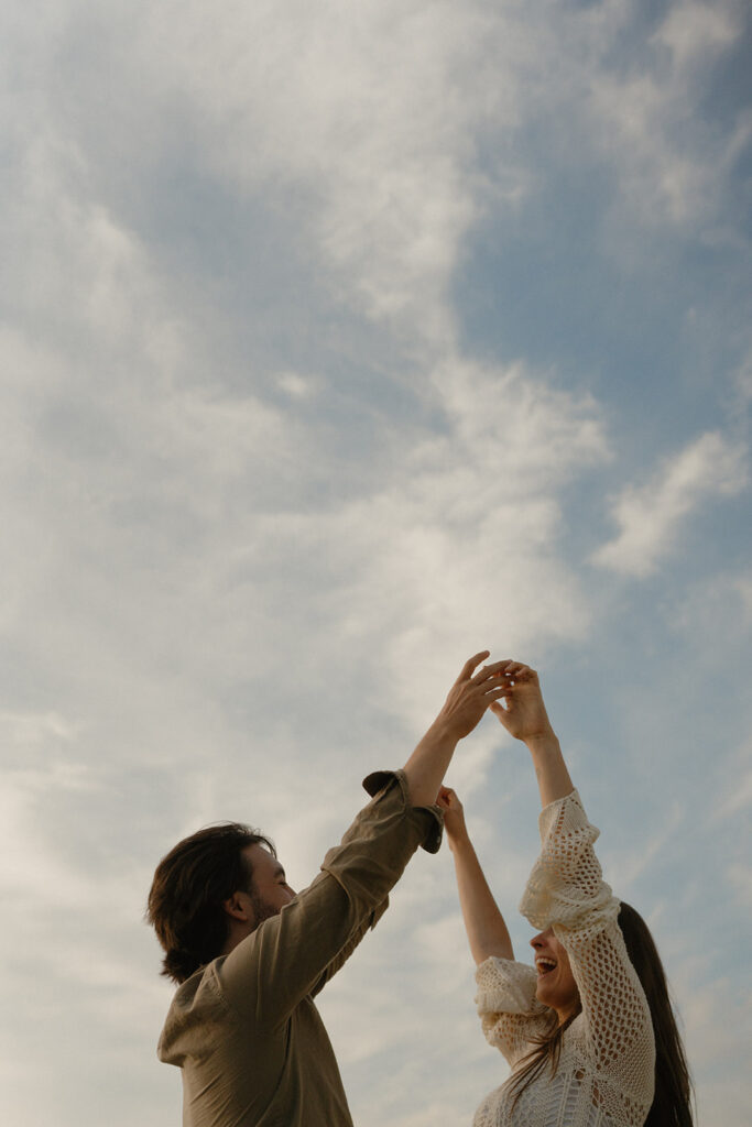 Couple dancing under the golden hour skies on a Washington State Ferry