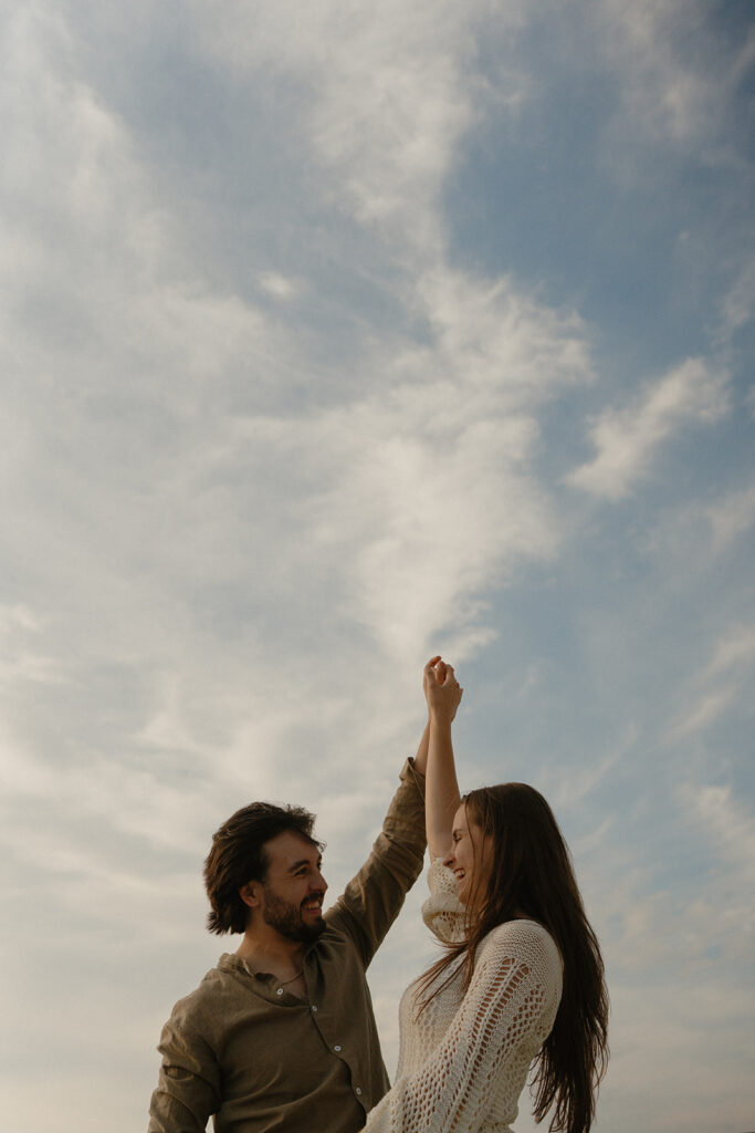 Couple dancing under the blue golden hour skies in the San Juan Islands