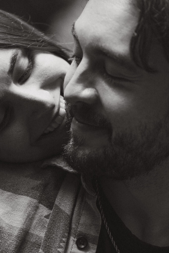 Black and white close up image of a couple nuzzling in together in the San Juan Islands